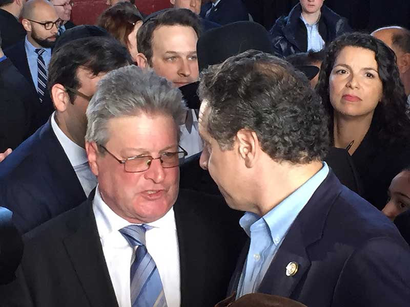 NYSABC's Albany liaison Pete Sobol brings Governor Andrew Cuomo up-to-date on C license concerns at a community forum in Nassau County on Sunday, February 26, 2017